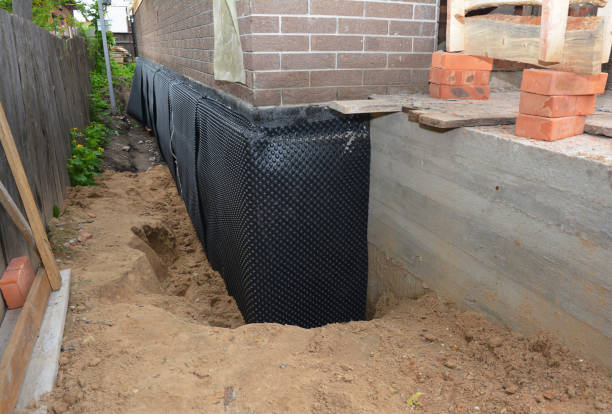 SJ Waterproofing Pros technician performing targeted Waterproofing assessment in Kensington, NY